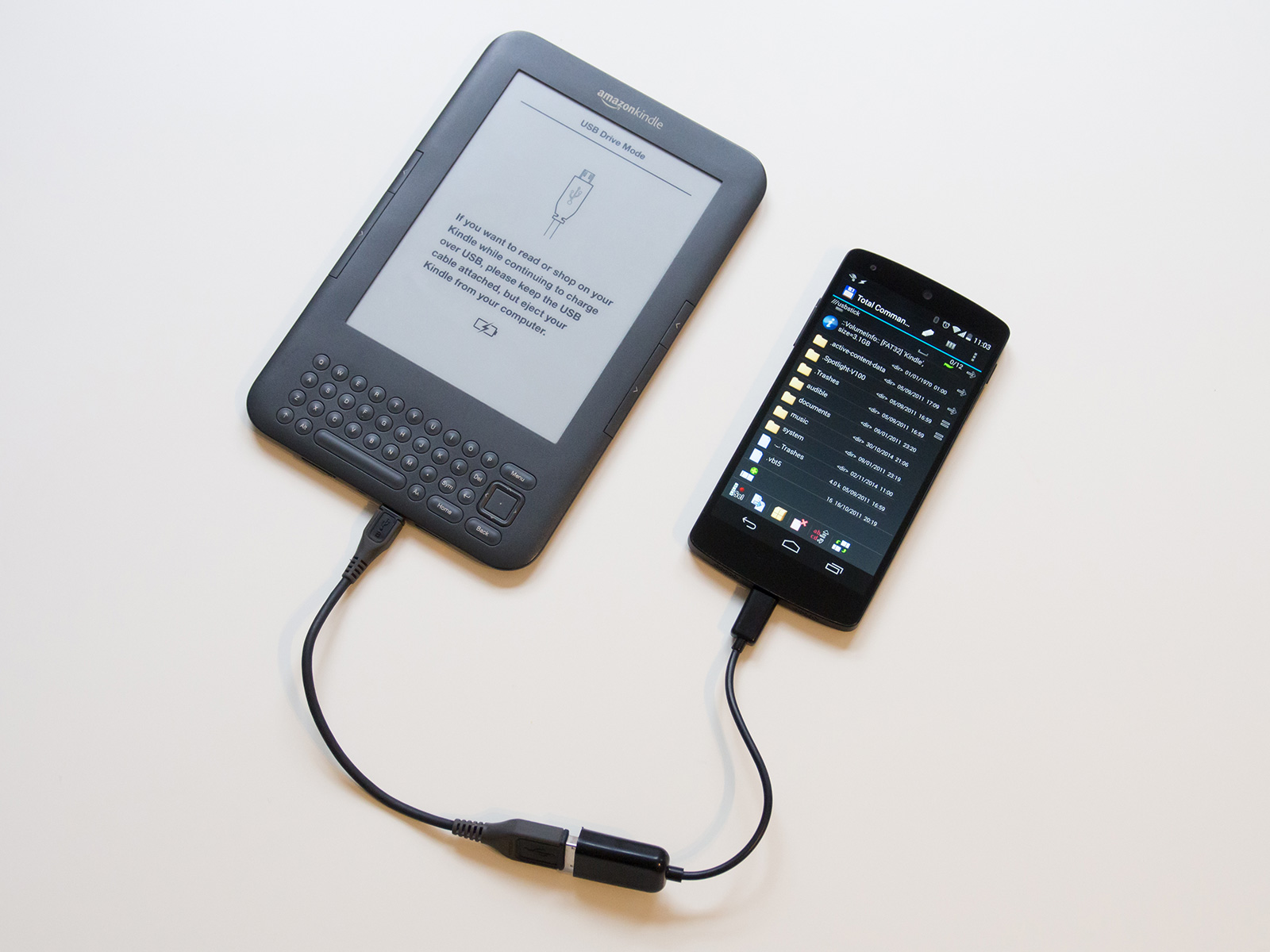 Kindle plugged into the Nexus 5 with a USB OTG cable